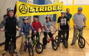 The teen group poses with their Strider bikes at East Boulder Recreation Center where they practice.  