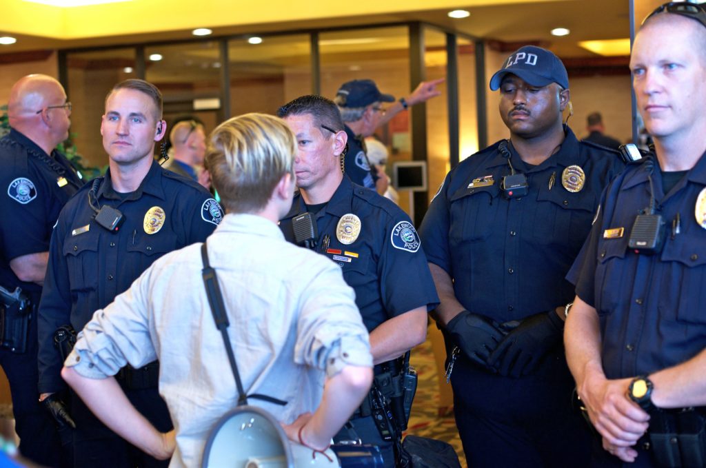 At the May 12 Bureau of Land Management (BLM) oil and gas lease auction held at a Lakewood Holiday Inn, protesters determined to stop the sale by blocking the entrances to the hotel and the conference room where the sale was being held, ran into a police line in the hotel’s lobby and at every entrance to the building.