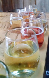 Ciders and a fresh kombucha are lined up for tasting at Denver’s Stem Ciders.