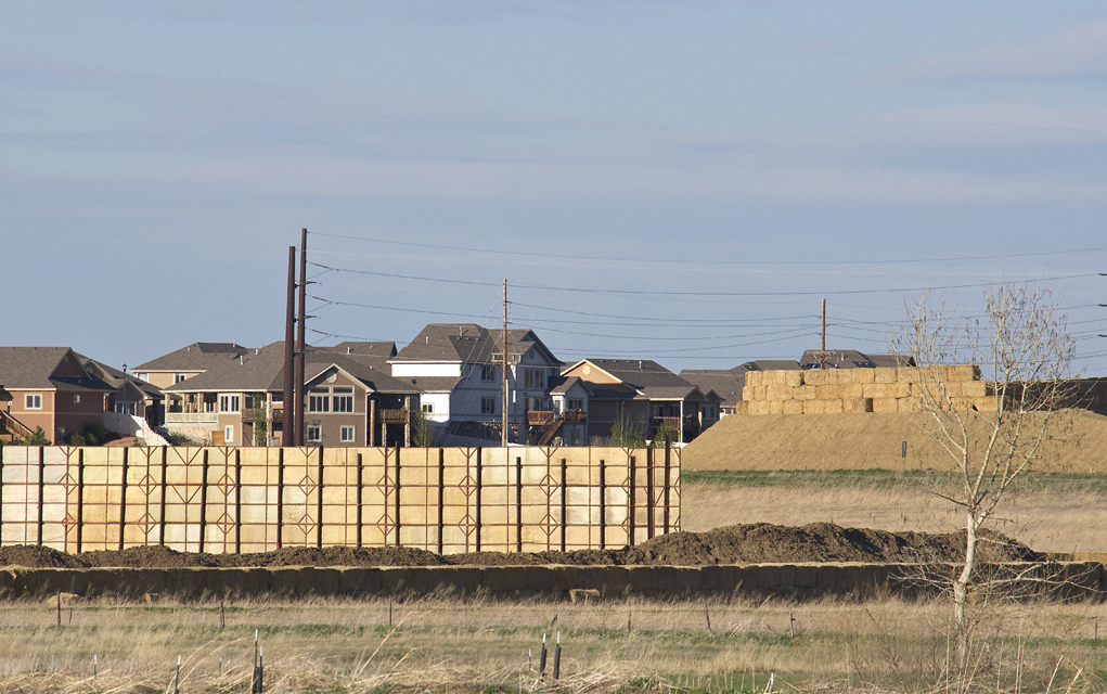 Three massive oil and gas drill sites and their subsequent production platforms have surrounded this neighborhood in Frederick, Colorado.