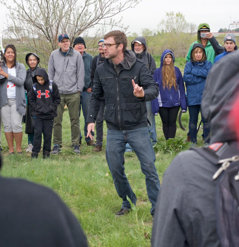 Jamie Laurie, better known as Jonny 5 of the Flobots, lead the crowd in early morning music and protest.