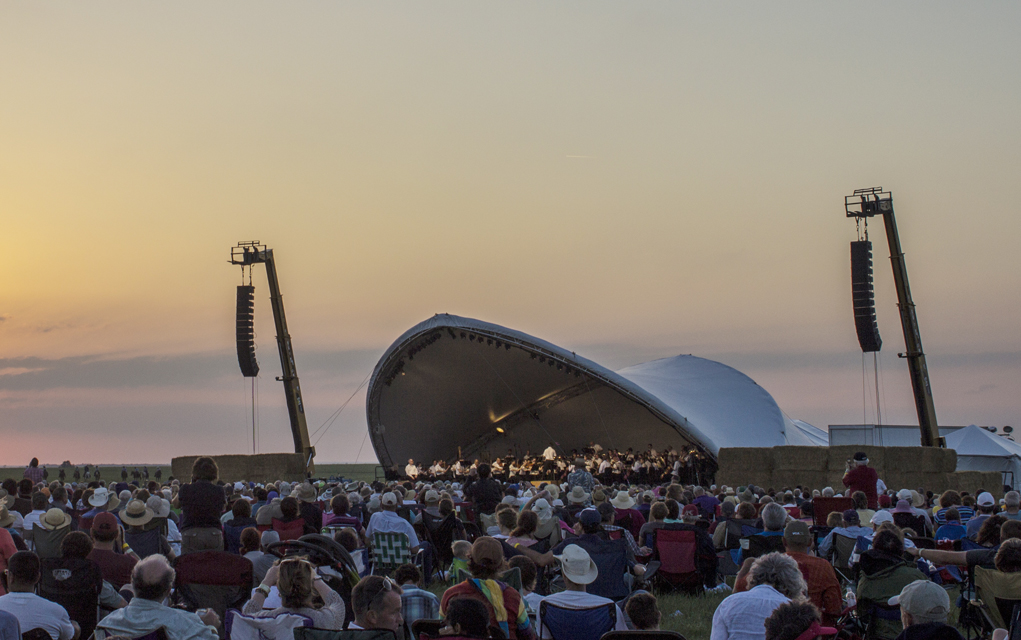 The sun sets as the Kansas City Symphony begins to play at the 9th Symphony in the Flint Hills in Rosalia, Kan. at Rosalia Ranch on June 14. 