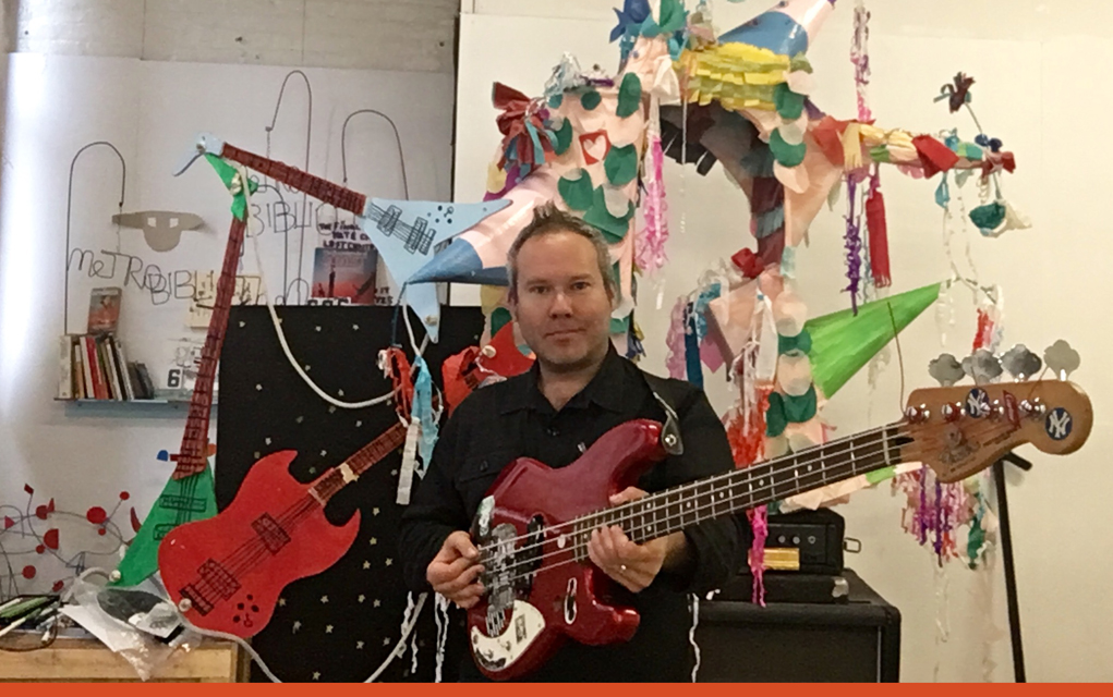 Carter in his studio with an election bass. 