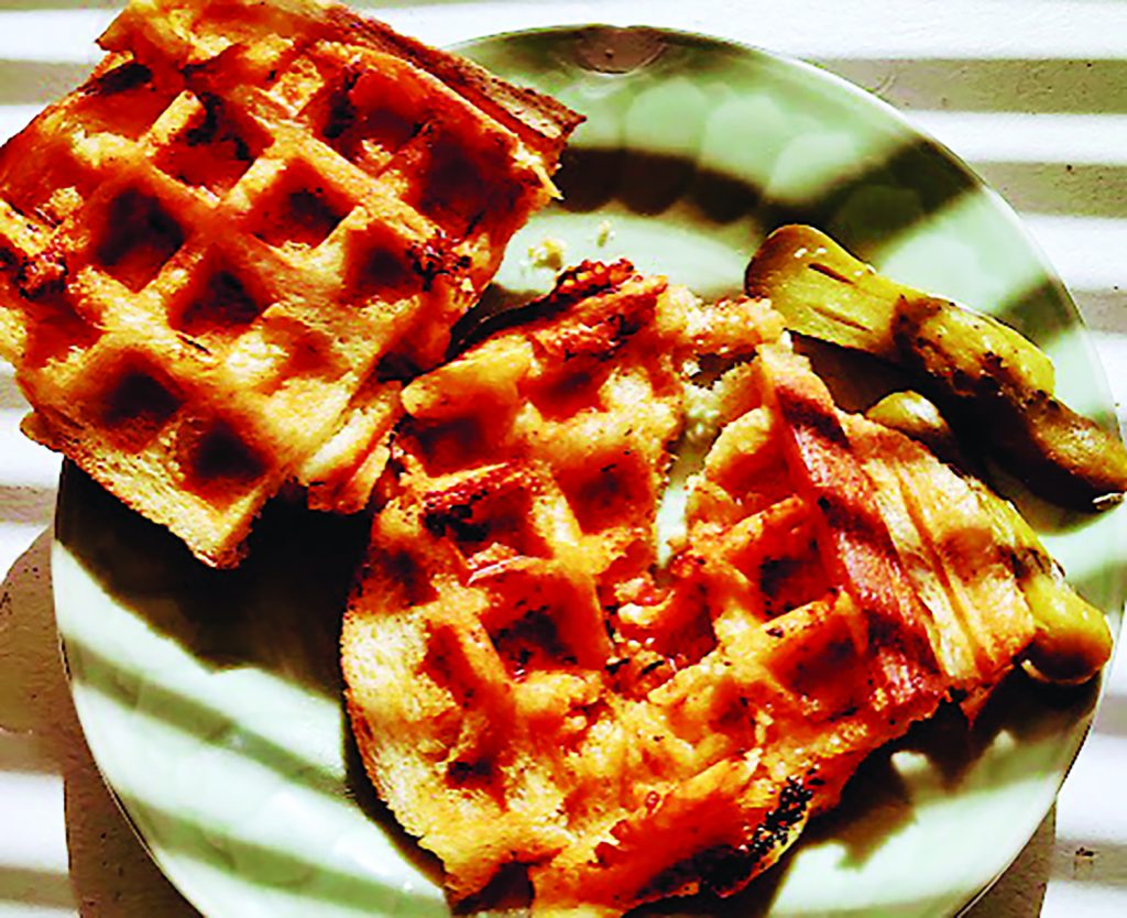 a grilled cheese utilizing waffles as bread.