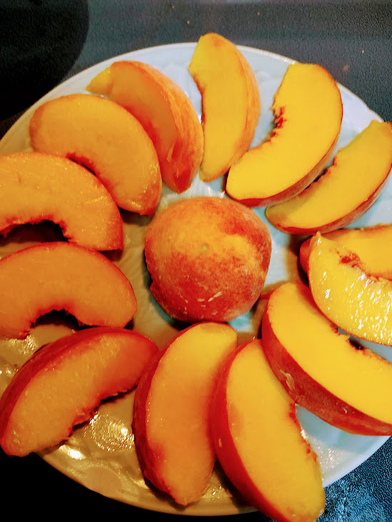 Colorado peaches sliced on a plate