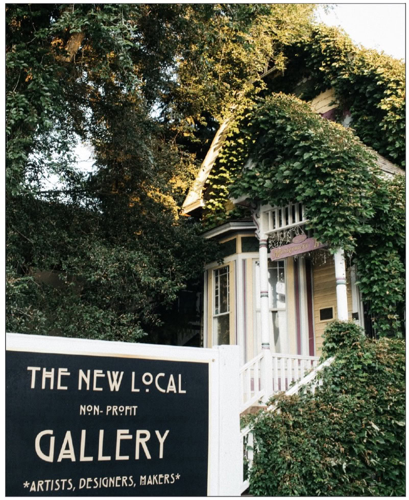 building covered in greenery and vines the new local art gallery