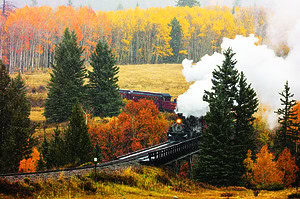 OCTOBER 9, 2018 - New Mexico, USA - Cumbres & Toltec Scenic Steam Train, from Chama, New Mexico to Antonito, Colorado over Cumbress Pass 10,015 Elevation - in Autumn and fresh snow - along Highway 17