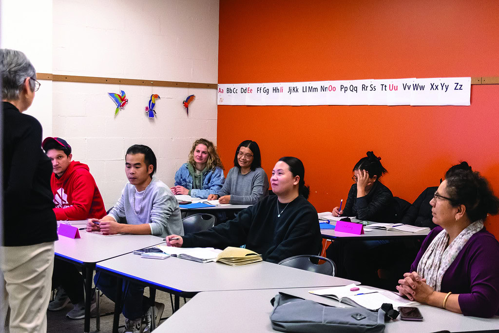 Intercambio refugee students in classroom learning English in Longmont Colorado