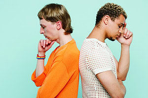 Side view sad young couple two gay men wear casual clothes together stand back to back pop up head chin isolated on plain blue color background studio portrait Pride day june month love LGBTQ concept