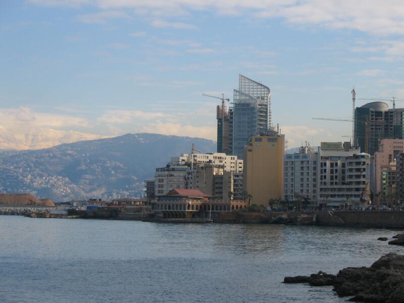 Bay of Saint George in Beirut with mountains and water and tall buildings where refugee Rohan Mesto lived