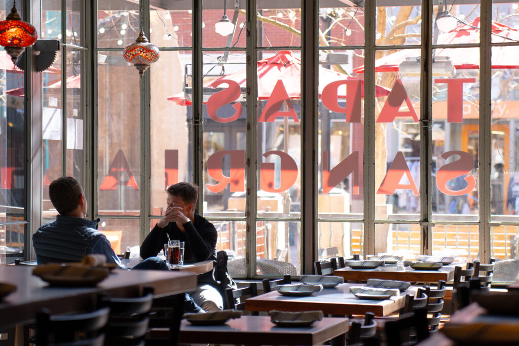 diners at a window-side table at High Country on Pearl Street in downtown Boulder, Colorado