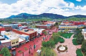 aerial of Boulder Pearl Street Mall with Flatirons mountains in the background, Colorado