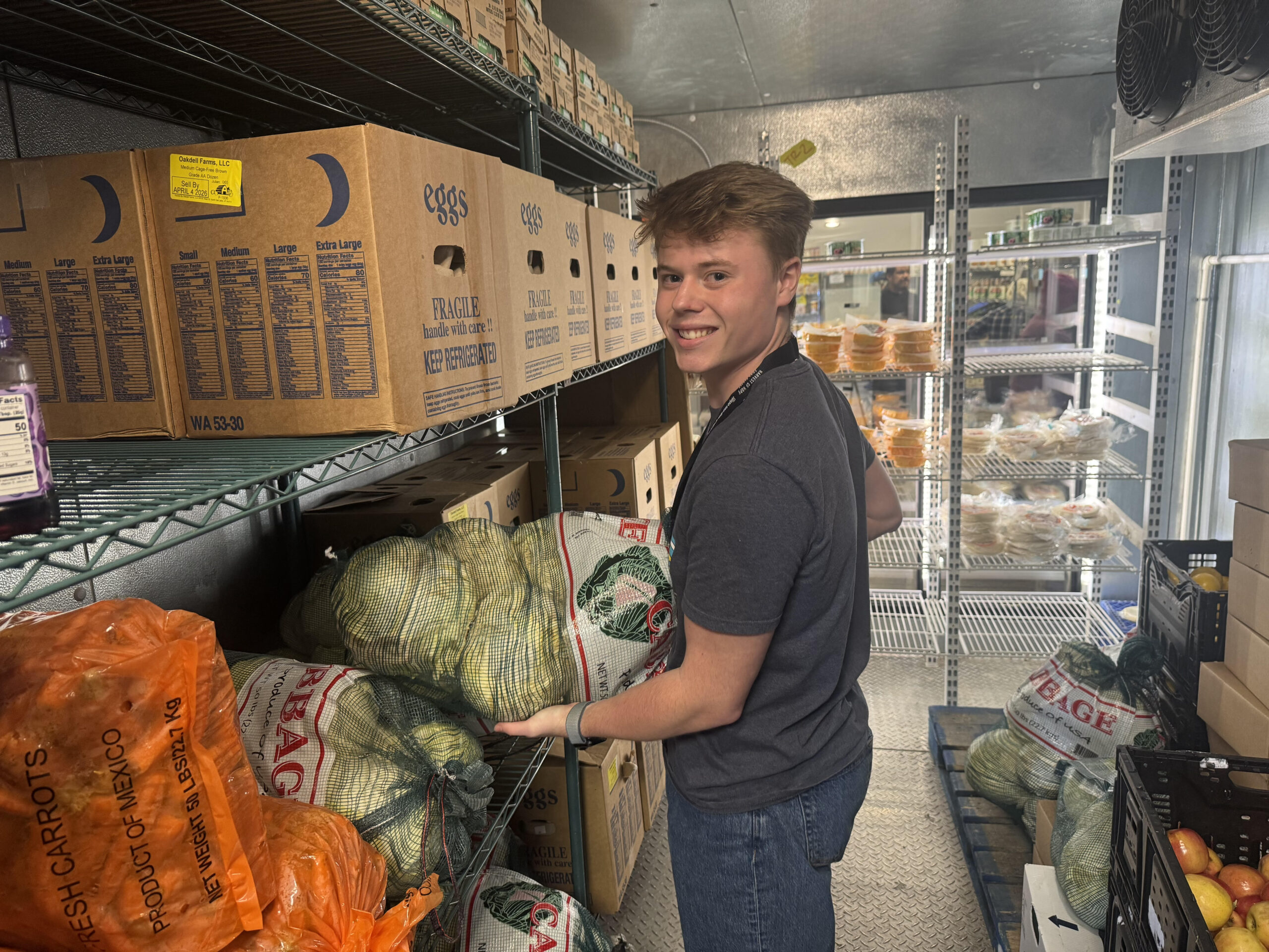 Stocking-the-walk-in-cooler-with-produce-scaled